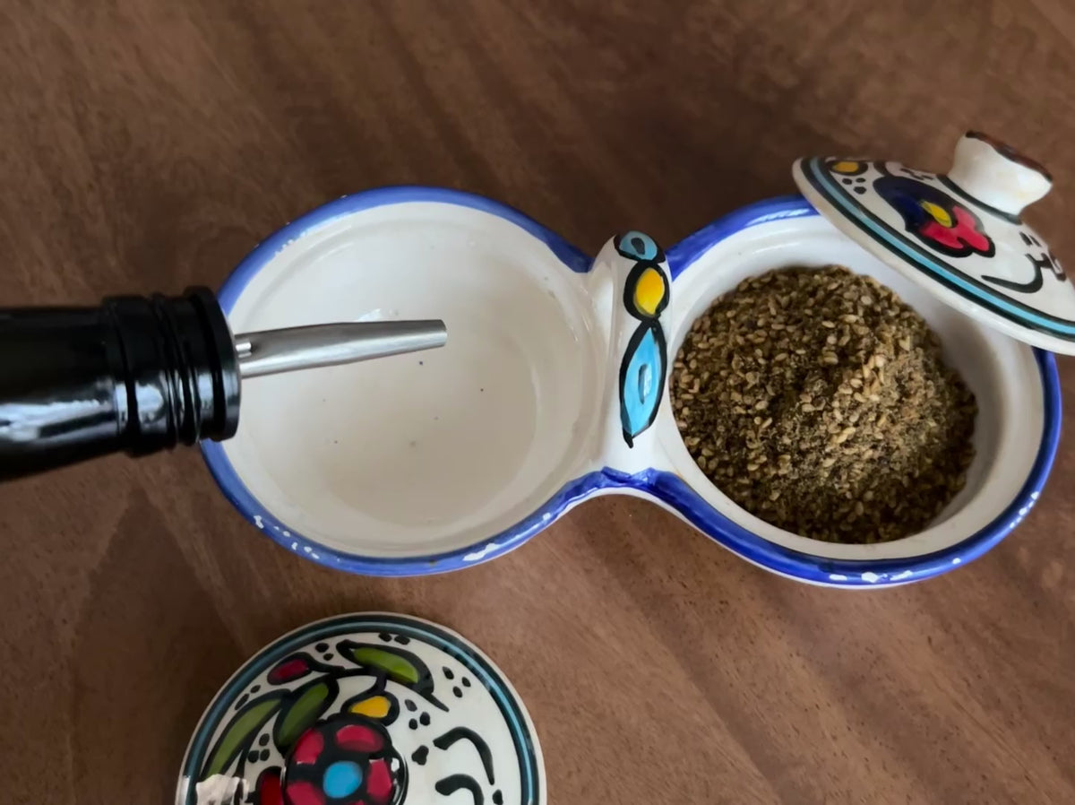 High-Quality Palestinian Olive Oil pouring in a ceramic with Zaatar.